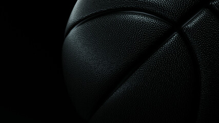 Photo of a black basketball ball on a black background.