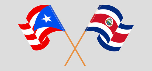 Crossed and waving flags of Puerto Rico and Costa Rica