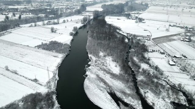 Drone shot of the river Ibar in a winter landscape