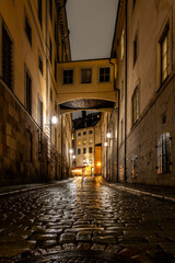 Fototapeta na wymiar Stockholm, Sweden The Norra Bankogrand street in Gamla Stan or Old Town in the rain at night