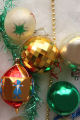 Colorful vintage Christmas ornaments and white faux fur blanket. Cute and kitschy Christmas...