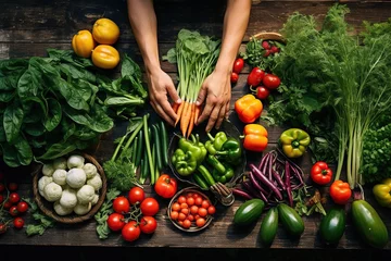 Keuken spatwand met foto Hand sorting freshly harvest fruits and vegetables on wooden table top. © Twomeows_AS