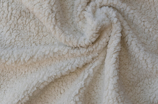 White soft plush lamb wool fabric background