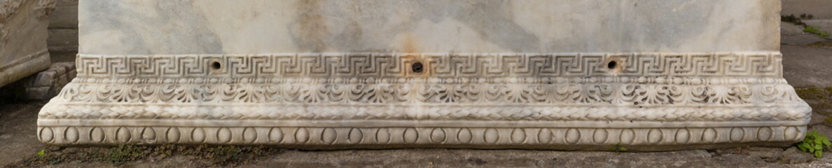 Old plaster sculptures and bas-reliefs, wall texture and patterns. Elements of architectural decorations of buildings. On the streets in Istanbul, public places.