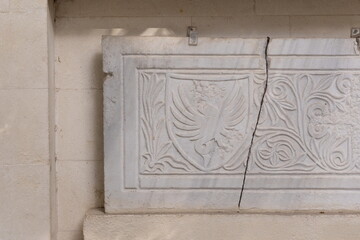 Old plaster sculptures and bas-reliefs, wall texture and patterns. Elements of architectural decorations of buildings. On the streets in Istanbul, public places.