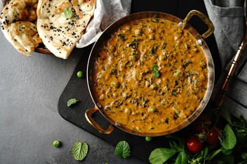 Homemade Methi Matar Malai -Indian vegetarian curry served with roti, selective focus