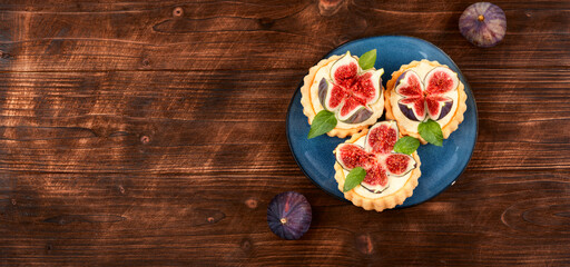 Fresh tartlets with figs, space for text.