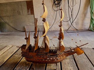 model of galleons made of wood after old. it is not a prefab but a carving work. has masts of sails...