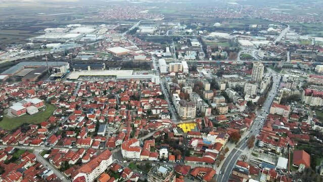 Aerial view of houses and buildings in town Leskovac in Serbia in foggy day