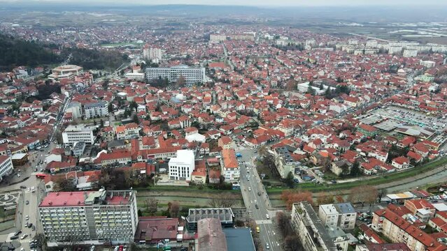Aerial view of houses and buildings in town Leskovac in Serbia in foggy day