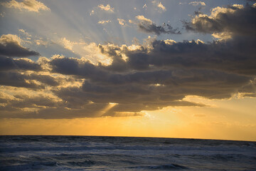 Obraz premium Sunrise on pounding surf at Sea Ranch beach in Indialantic Florida