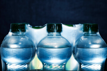 Detail of plastic bottles with water in packaging
