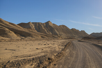 Fototapeta na wymiar Gravel road through Death Valley National Park, California