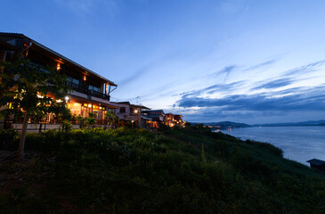 Landscape of classic wooden house on evening beside the Mekong river in Chiang Khan district, Loei.