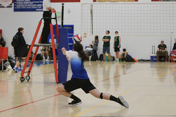 High School Volleyball player digging the ball