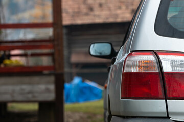 Parking old japanese AWD car , taillight on focus , space for text.