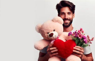 hombre joven llevando regalo de San Valent&iacute;n, osito, flores y coraz&oacute;n, 