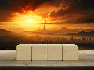 Four wood block cubes on wooden table over aerial panoramic view of modern city tower and mountain at golden hour