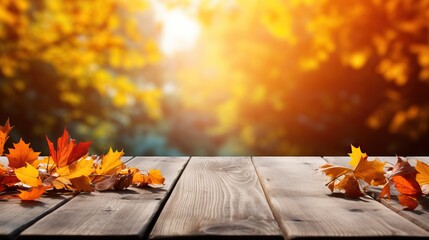 Naklejka na ściany i meble Wooden table with autumn leaves on bokeh background