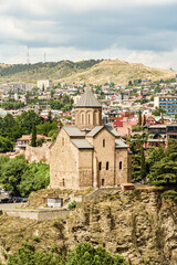 Fototapeta na wymiar View of Metekhi, with parts of Tbilisi's Old Town seen on the horizon.