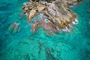 bird eye drone photography, granite rocks, turquoise and transparent water, near the shore, sunset beach, Mahe, Seychelles 