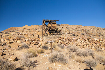 Fototapeta na wymiar Old wooden mining entrance at Eureka Gold Mine in the desert, Death Valley National Park, California