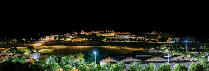 Panoramic shot of illuminated buildings at night in Elvas, Alentejo, Portugal