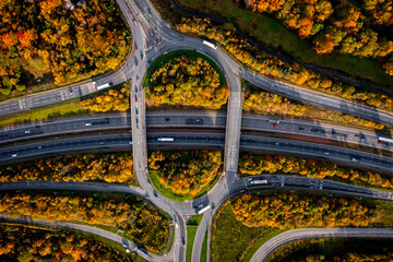 Aerial view directly above a major UK motorway junction with Autumn colours - obrazy, fototapety, plakaty