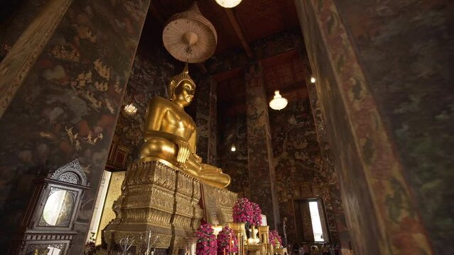 Golden Buddha statue in the Phra Wihan Luang, Wat Suthat Thepwararam.