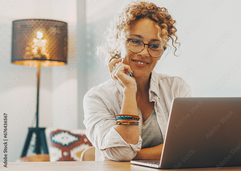 Sticker Modern business freelance woman work on laptop at home on the table. Alternative house workplace office and online female people enjoying smart working with computer and internet connection. Business