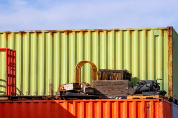 Abstract shipping containers with junk piled around them