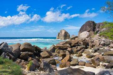 Sunny, white sandy beach, huge granite rocks at port glaud beach, Mahe, Seychelles 1