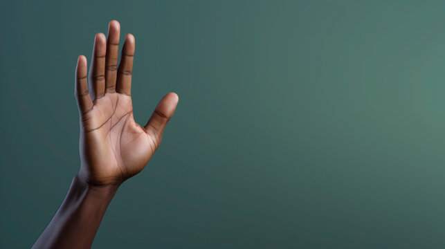 Open hand raised against a teal background, symbolizing openness, aid.