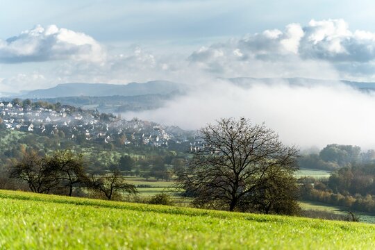 Beautiful view of the Nurtingen town in the Swabian Alps covered with fog in autumn