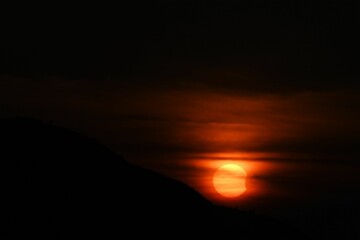 A solar eclipse in a sunset