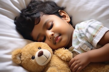 Obraz na płótnie Canvas Toddler boy in shirt sleeps sweetly in company of best friend teddy bear seeing pleasant dreams