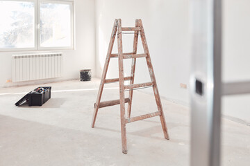 Ladders and tools on a construction site.