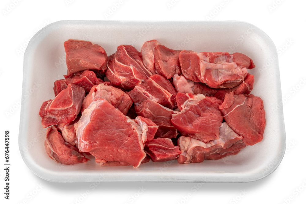 Wall mural raw diced red beef meat for goulash or meat stew raw in food grade plastic tray. isolated