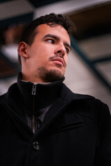 Close-up portrait of latino boy looking elsewhere.