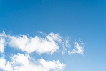 Beautiful blue sky with strange shape of clouds in the morning or evening used as natural background texture in decorative art work.