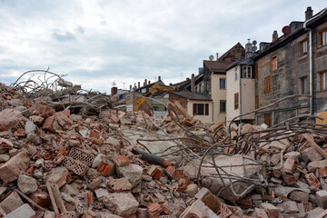 A pile of bricks after dismantling an old building in the historic center of the city