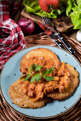 Homemade potato pancakes with goulash.