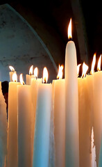 Burning candles in Lourdes