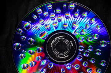 Water drops on a CD creating psychedelic visuals effect