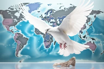 Fotobehang Concept for the International Day of Peace. White dove on the background of the world map in light colors, Humanity needs peace on Earth. The dove of peace © Eli Berr