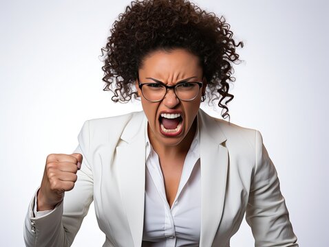 A woman in a state of extreme rage, with clenched fists and jaw, angry, emotional and furious. Generated by AI.