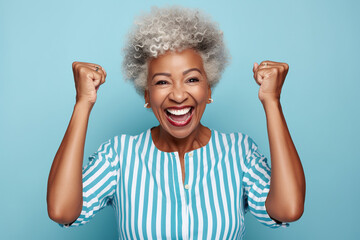 Elderly exultant overjoyed jubilant African American woman 50s years old wear light striped shirt look camera spread hands say wow isolated on plain pastel blue cyan color background studio