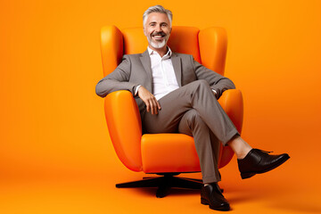 Full length body cadre of satisfied businessman sitting psychotherapist session comfortable armchair isolated on orange color background - obrazy, fototapety, plakaty