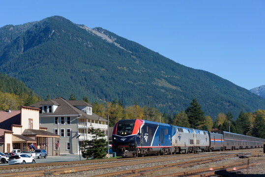 Skykomish, WA, USA - October 28, 2023; Amtrak Empire Builder train passing Cascade Mountains and Skykomish westbound
