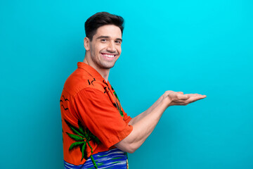 Profile photo of satisfied proposition youngster guy macho holding two hands demonstrate banana...